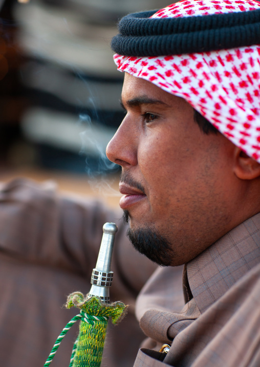 Saudi bedouin smoking shisha, Al-Jawf Province, Sakaka, Saudi Arabia
