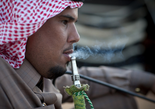 Saudi man smoking shisha, Al-Jawf Province, Sakaka, Saudi Arabia