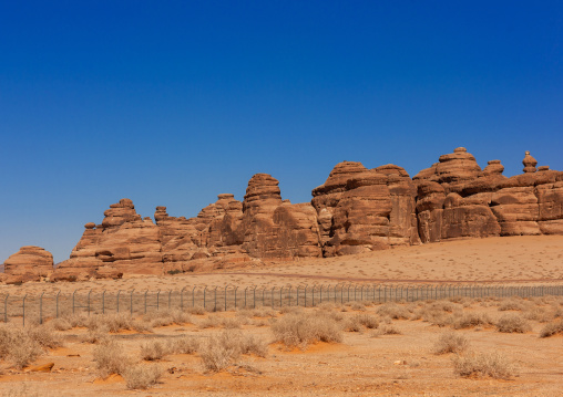 fence along Nabataean tomb in madain saleh archaeologic site, Al Madinah Province, Al-Ula, Saudi Arabia