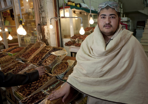 Afgani man selling dates in the souk, Mecca Province, Taif, Saudi Arabia