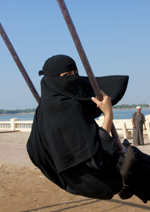 Saudi girl on a swing, Mecca province, Jeddah, Saudi Arabia
