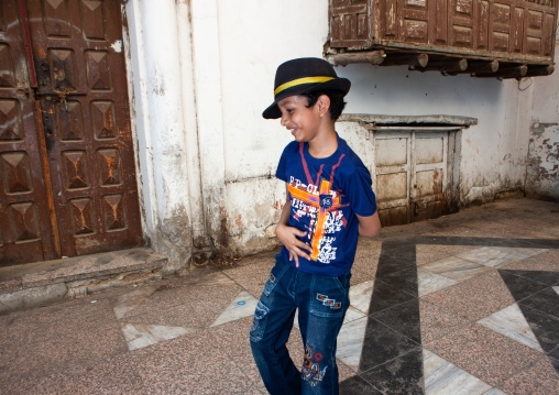 Boy dancing in a street of the old quarter, Hijaz Tihamah region, Jeddah, Saudi Arabia