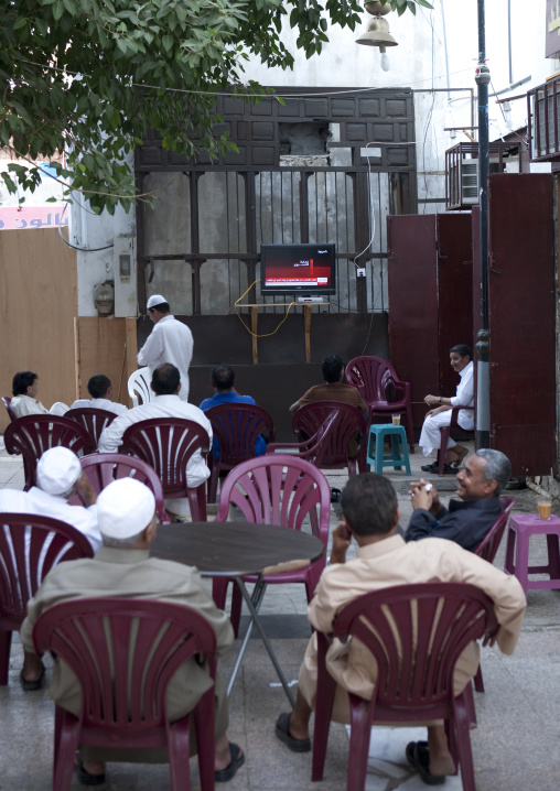 Men watching tv in a coffee in Al Balad, Mecca province, Jeddah, Saudi Arabia