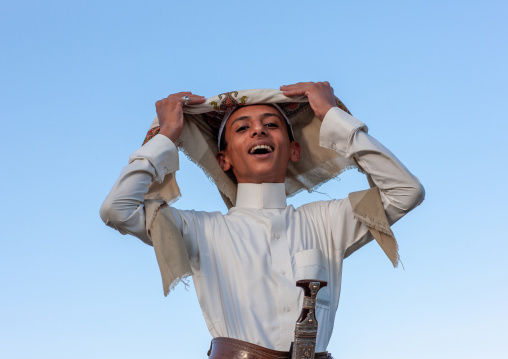 Young saudi man in traditional clothing wearing a jambyia, Al-Sarawat, Fifa Mountains, Saudi Arabia