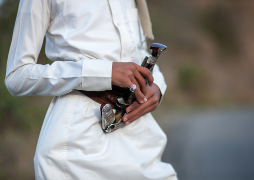 Young saudi man in traditional clothing wearing a jambyia, Al-Sarawat, Fifa Mountains, Saudi Arabia