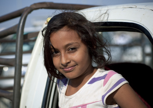 Saudi girl in front of a car, Jizan Province, Sabya, Saudi Arabia