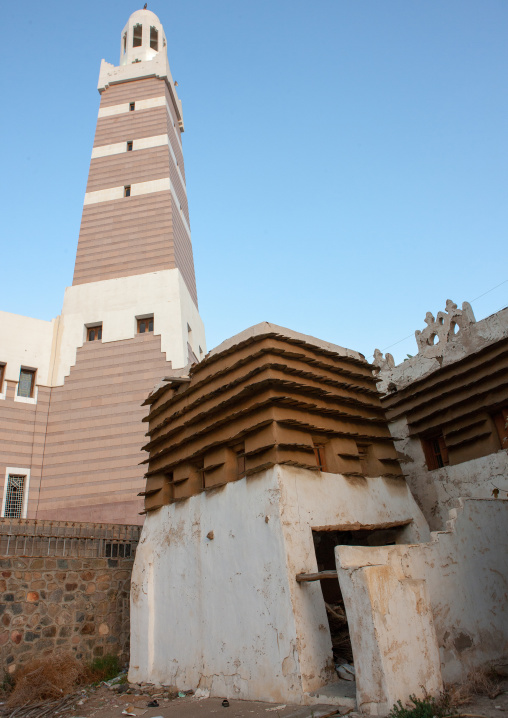 Old traditional house in front of a mosque, Asir province, Abha, Saudi Arabia