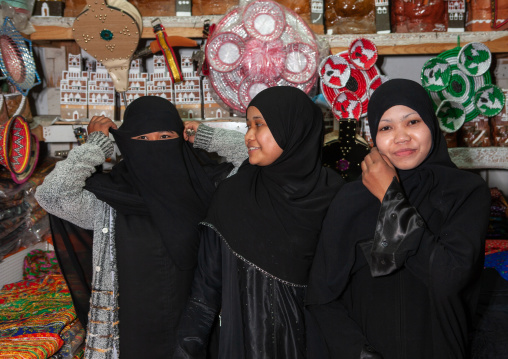 Indonesian muslim foreign women in the souk working as sellers in a shop, Asir province, Abha, Saudi Arabia