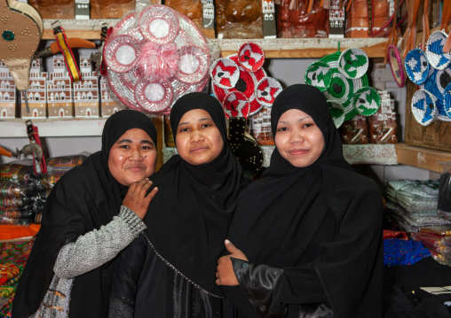 Indonesian muslim foreign women in the souk working as sellers in a shop, Asir province, Abha, Saudi Arabia