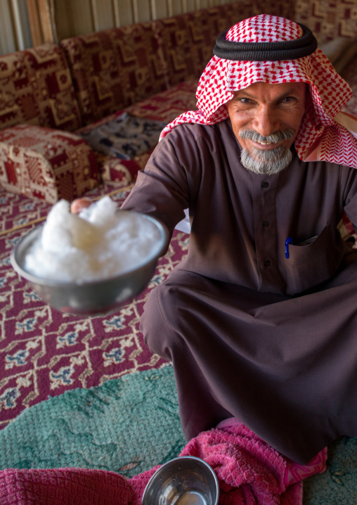 Saudi man offering fresh camel milk, Riyadh Province, Riyadh, Saudi Arabia