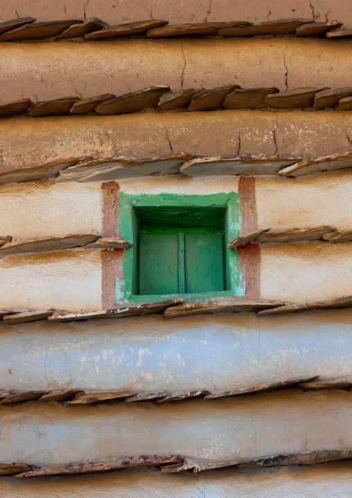 Green window of a traditional clay and silt homes in a village, Asir Province, Aseer, Saudi Arabia