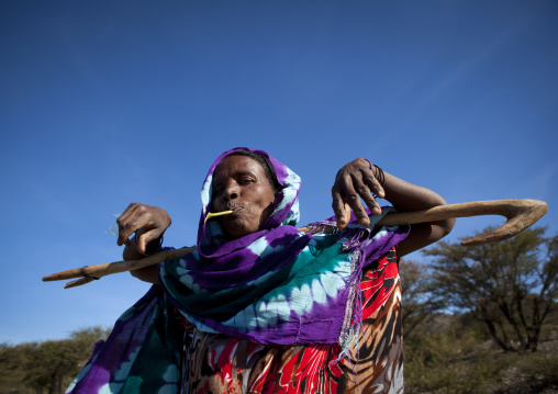 Portrait Of A Mature Woman Holding A Shepherd Stich And Chewing Wood, Zeila, Somaliland