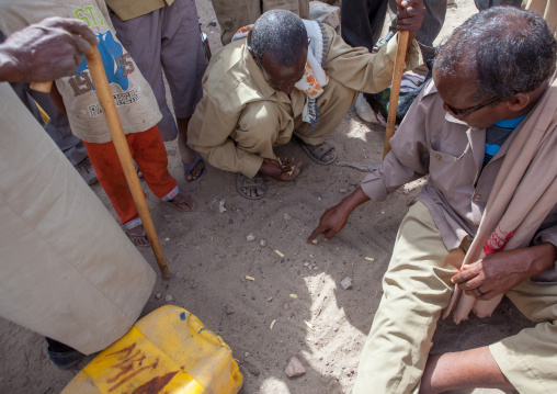 Somali men playing a chess game in the sand, Woqooyi Galbeed region, Hargeisa, Somaliland