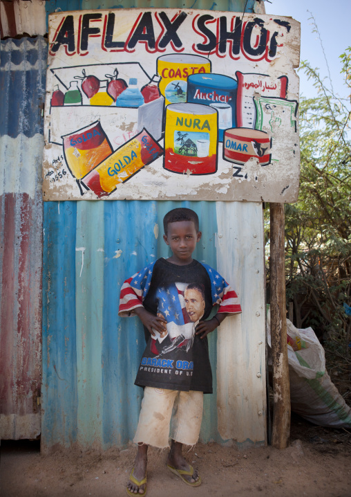 A Boy In Front Of A Painted Advertisment Wearing Obama T Shirt, Hargeisa, Somaliland