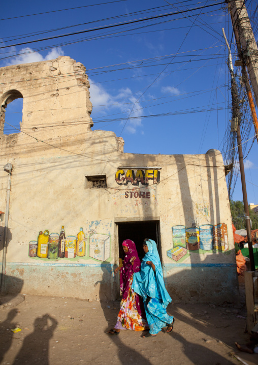 Two Young Women Passing By A Street Of Hargeisa, Somaliland