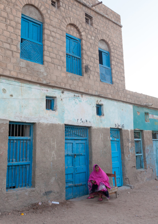 Somali woman in front of a former ottoman empire house, North-Western province, Berbera, Somaliland