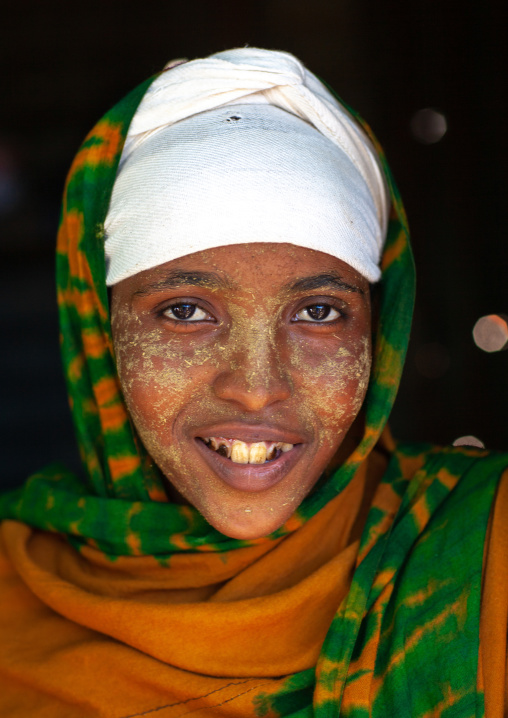 Portrait of a smiling somali girl with qasil on her face, North-Western province, Berbera, Somaliland