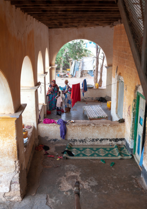 Somali women under the arcades of a former ottoman house, North-Western province, Berbera, Somaliland