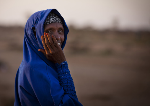 Portrait Of A Mature Woman Wearing A Blue Hijab And Laughing, Baligubadle, Somaliland