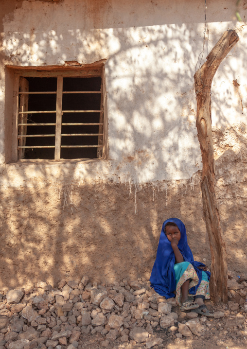 Young somali girl sit in the shadow in the street, Woqooyi Galbeed province, Baligubadle, Somaliland