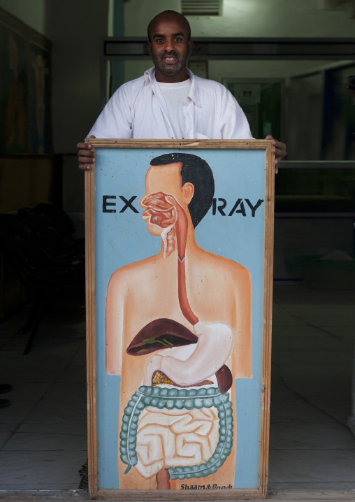 A Doctor Posing With XRay Painted Advertisment, Hargeisa, Somaliland