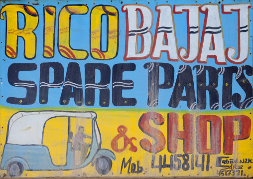 A Painted Bilboard Advertising For A Garage Repairing Cars And Selling Parts, Boorama, Somaliland