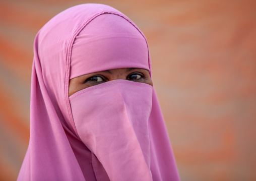 Portrait of a somali woman wearing a pink niqab, Woqooyi Galbeed region, Hargeisa, Somaliland
