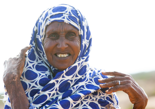 Old somali woman adjusting her hijab, Awdal region, Zeila, Somaliland