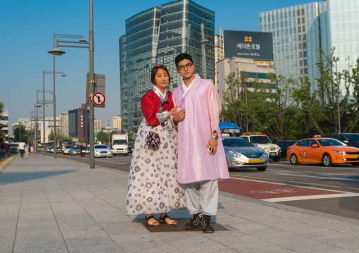Couple in traditional korean clothing in the street, National capital area, Seoul, South korea