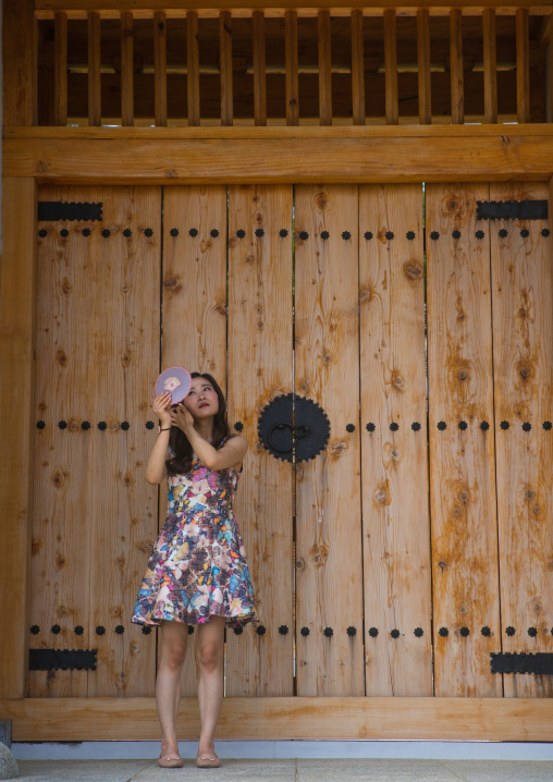 South korean woman called juyeon in front of a temple door, Sudogwon, Paju, South korea