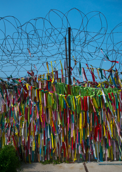 Messages of peace and unity written on ribbons left on fence at dmz, Sudogwon, Paju, South korea