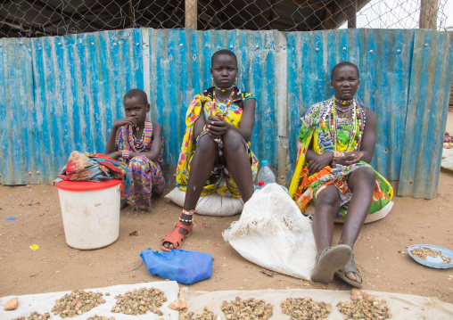 Toposa tribe women in traditional clothing in a market, Namorunyang State, Kapoeta, South Sudan