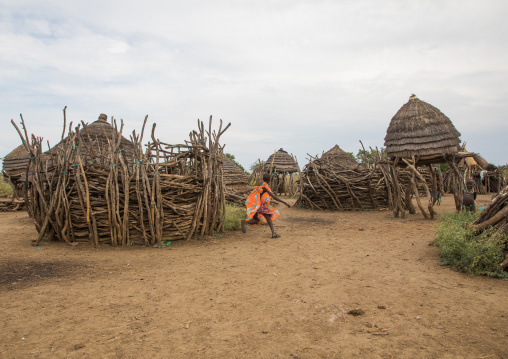 Girl running in a traditional Toposa tribe village, Namorunyang State, Kapoeta, South Sudan