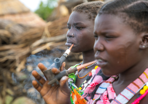 Toposa tribe women smoking pipes, Namorunyang State, Kapoeta, South Sudan
