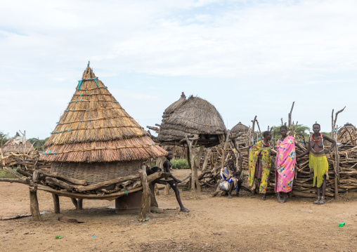 Toposa tribe women standing near a granary in a village, Namorunyang State, Kapoeta, South Sudan
