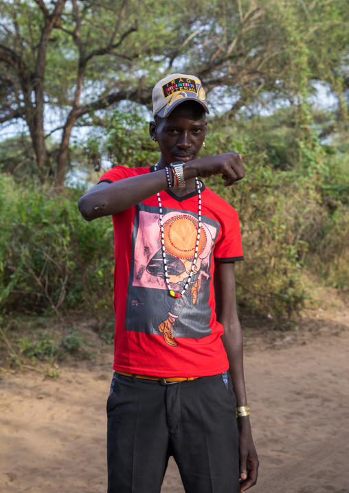 Toposa tribe young man wearing western clothes, Namorunyang State, Kapoeta, South Sudan