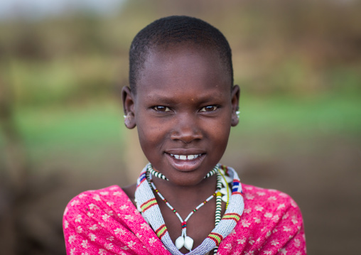Portrait of a smiling Toposa girl, Namorunyang State, Kapoeta, South Sudan