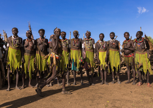 Toposa tribe women in traditional clothing dancing during a ceremony, Namorunyang State, Kapoeta, South Sudan