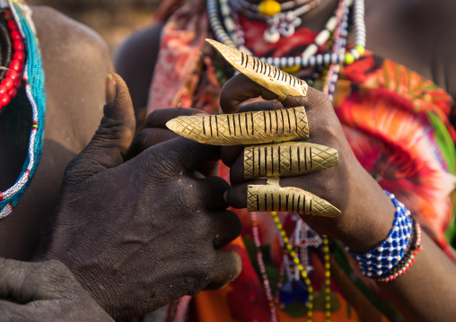 Toposa tribe huge rings on the fingers of a woman, Namorunyang State, Kapoeta, South Sudan