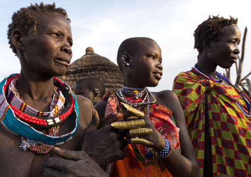 Toposa tribe women in traditional clothing and waering big rings, Namorunyang State, Kapoeta, South Sudan