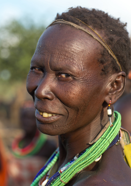 Portrait of a smiling Toposa tribe woman, Namorunyang State, Kapoeta, South Sudan