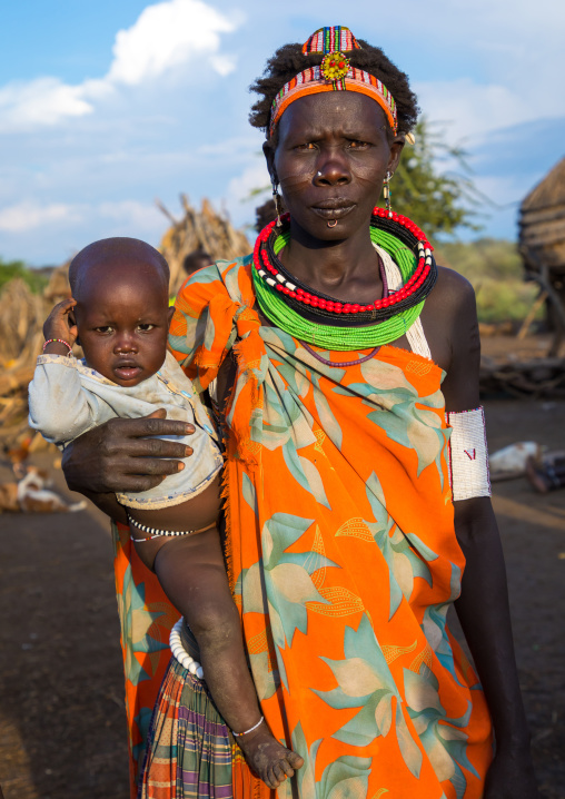 Toposa tribe woman carrying her baby, Namorunyang State, Kapoeta, South Sudan
