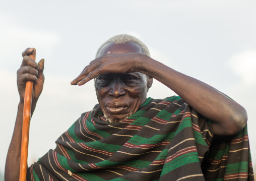 Toposa tribe senior man with a wood stick, Namorunyang State, Kapoeta, South Sudan