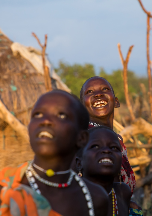 Laughing Toposa tribe children looking up in the sky, Namorunyang State, Kapoeta, South Sudan