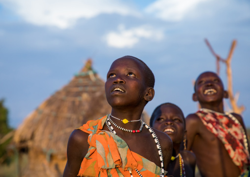 Toposa tribe children looking up in the sky, Namorunyang State, Kapoeta, South Sudan