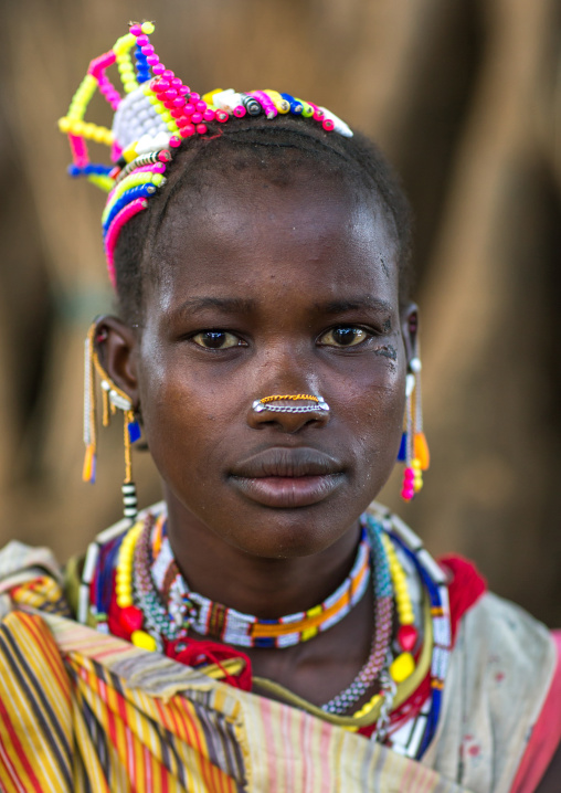 Larim tribe woman with traditional decorations on the head, Boya Mountains, Imatong, South Sudan