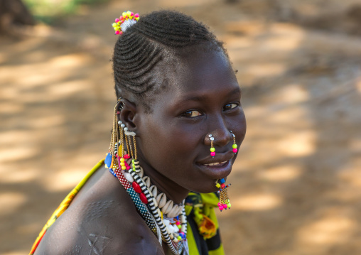 Portrait of a Larim tribe woman with traditional eaerrings and Nose earrings, Boya Mountains, Imatong, South Sudan