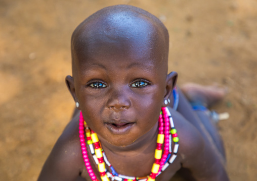 Larim tribe baby girl with necklaces, Boya Mountains, Imatong, South Sudan