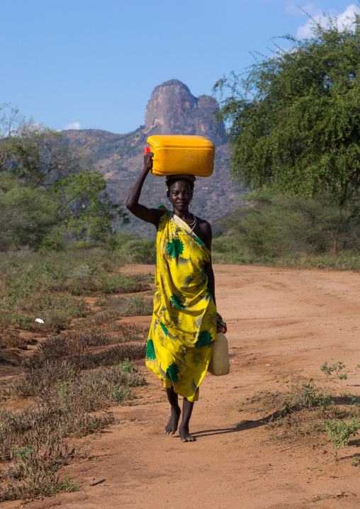 Portrait of a Larim tribe woman carrying a jerrycan of water on the head, Boya Mountains, Imatong, South Sudan