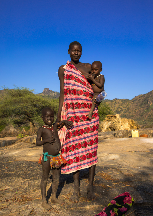 Larim tribe woman carrying her baby, Boya Mountains, Imatong, South Sudan
